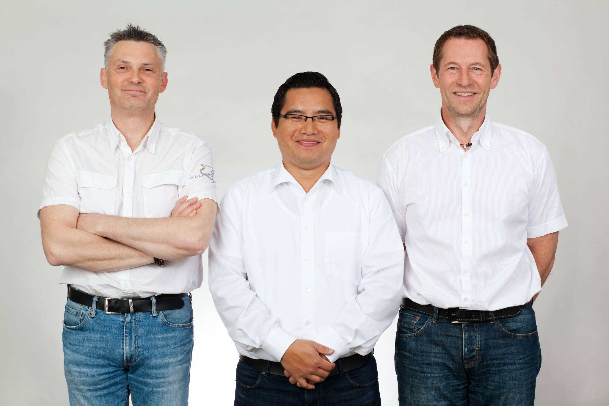 Gruppenportrait, drei Mitarbeiter